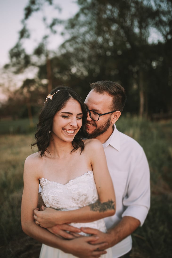 Photo of Man Embracing a Woman